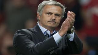 Chelsea's manager Jose Mourinho applauds supporters as he walks from the pitch after his team's 0-0 draw against Manchester United during their English Premier League soccer match at Old Trafford Stadium, Manchester, England, Monday Aug. 26, 2013. (AP Photo/Jon Super) Britain Soccer Premier League